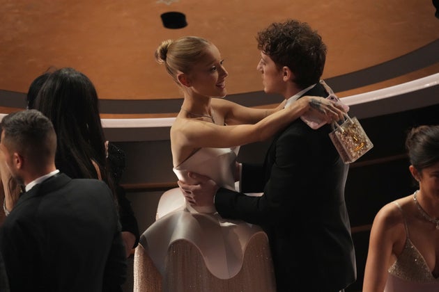 Ariana Grande and Ethan Slater pictured in the audience of last year's Oscars