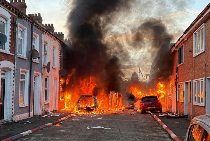 Vehicles set on fire by protesters on Lendrick Street in Belfast, as disorder flared in response to Monday night's stabbing attack in the city. Protests were encouraged online by far-right activists including Stephen Yaxley-Lennon, also known as Tommy Robinson.