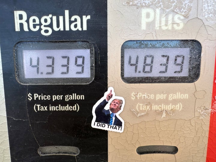 A sticker of President Donald J. Trump points to the electronically-posted prices for a gallon of regular or regular plus gasoline available at a Conoco station Saturday, May 30, 2026, in Denver. (AP Photo/David Zalubowski)