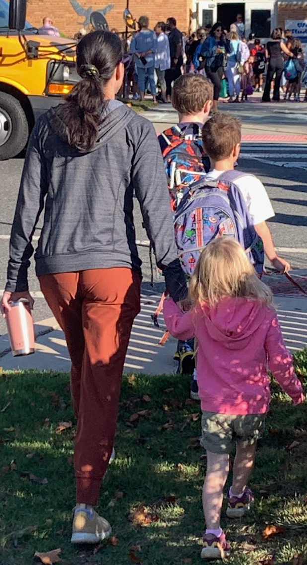 The author walking her children into school on their first day.