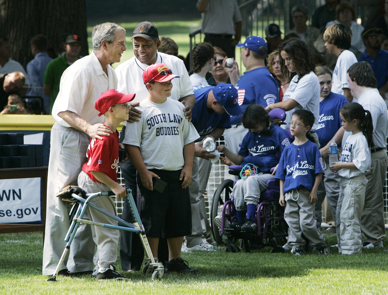 President George W. Bush (left) and National Baseball Hall of Fame member Willie Mays at the conclusion of the White House T-Ball Game on the South Lawn in 2006 in Washington, D.C.