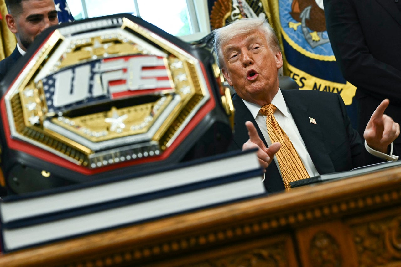 A UFC championship belt is displayed in the Oval Office as Trump speaks about the upcoming UFC Freedom 250 event.