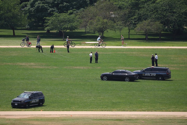 WASHINGTON, DC - JUNE 11: Members of law enforcement respond to the National Mall as the numbers “8647” are seen in the grass on June 11, 2026 in Washington, DC. The U.S. Park Police are handling the investigation into the markings in the grass. (Photo by Kevin Dietsch/Getty Images)