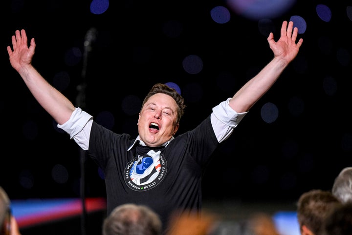 KENNEDY SPACE CENTER, FL - MAY 30: SpaceX founder Elon Musk jumps for joy at a gathering following NASA commercial crew astronauts Doug Hurley (L) and Bob Behnken blast off from historic Launch Complex 39A aboard the SpaceX Falcon 9 rocket in the crew Dragon capsule bound for the International Space Station. (Photo by Jonathan Newton/The Washington Post via Getty Images)