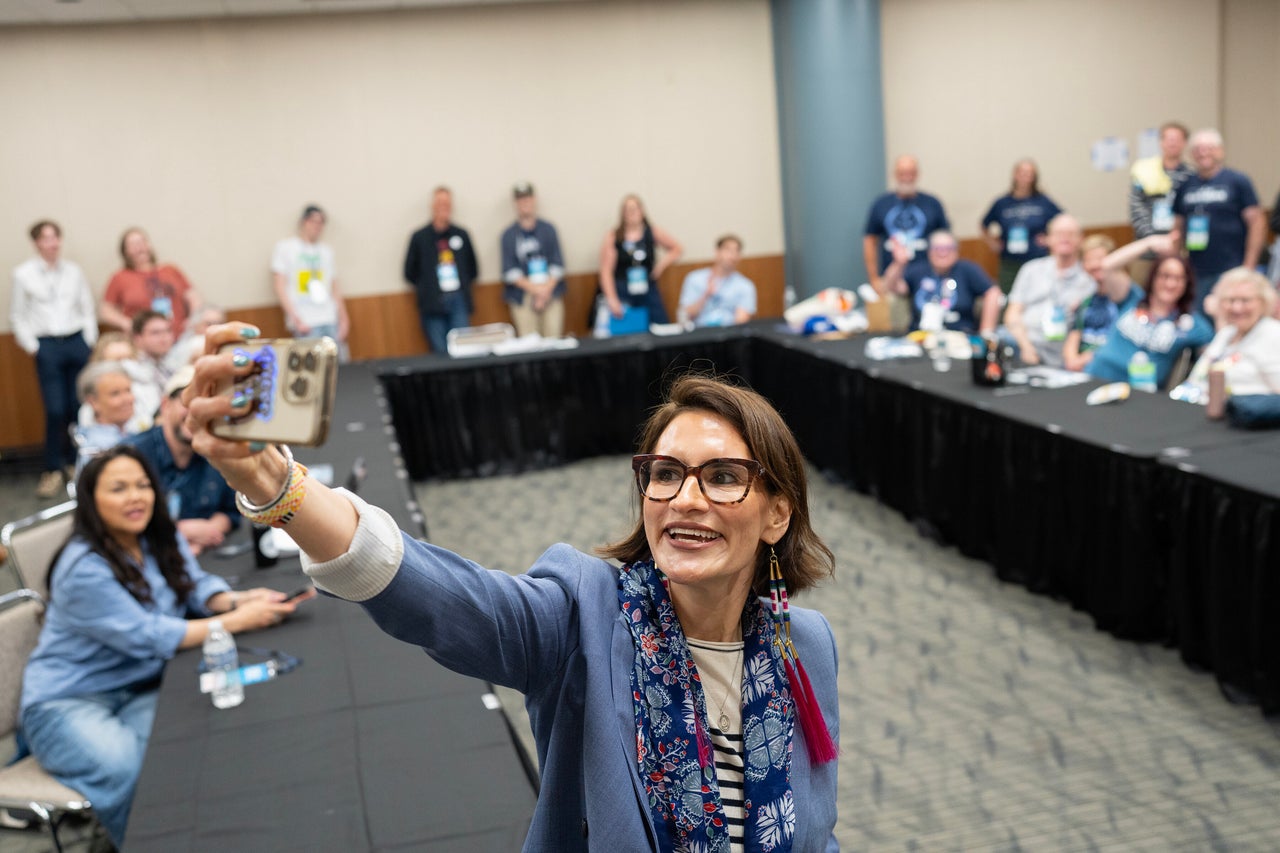Minnesota Lt. Gov. Peggy Flanagan takes a selfie with a room of volunteers during day one of the Minnesota Democratic-Farmer-Labor Party convention in Rochester.