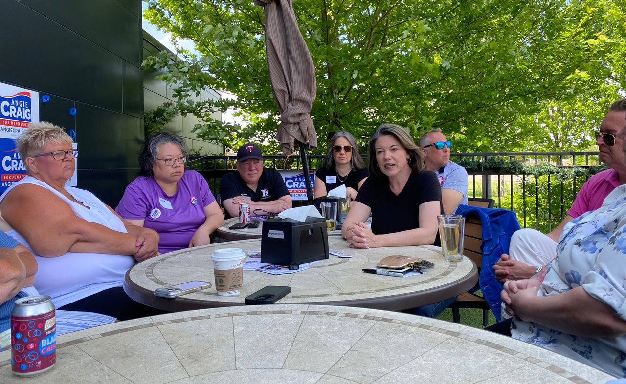 Rep. Angie Craig (D-Minn.) talks with voters at a brewery in Woodbury, Minnesota, about her experience in working with House Republicans.
