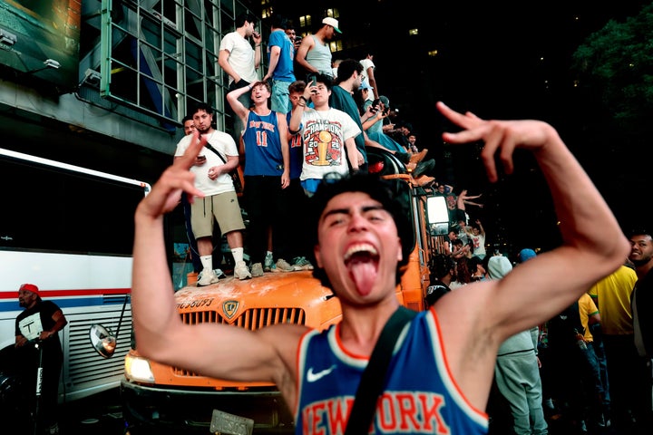 New York Knicks fans celebrate on Saturday. (AP Photo/Heather Khalifa)