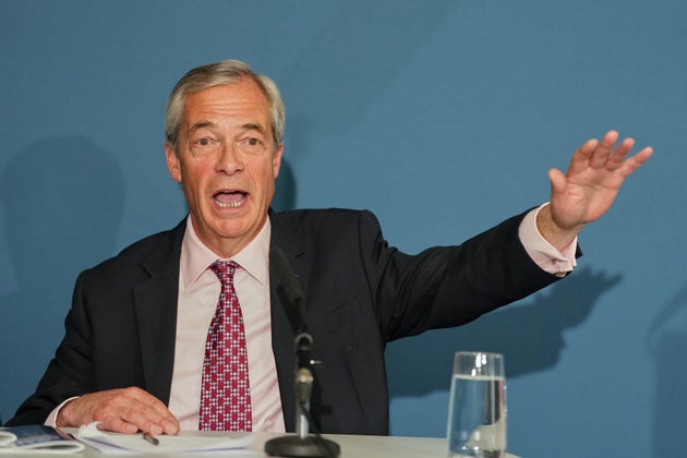 Nigel Farage leader of the Reform UK party gestures during a press conference in London, Monday, April 13, 2026. (AP Photo/Kirsty Wigglesworth)