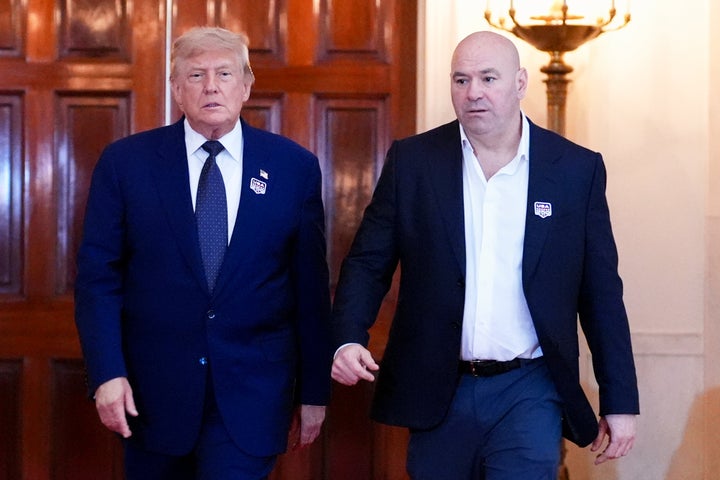 President Donald Trump, left, and Dana White, president of Ultimate Fighting Championship (UFC), walk through the Cross Hall ahead of the "UFC Freedom 250" event on the South Lawn of the White House on Sunday.