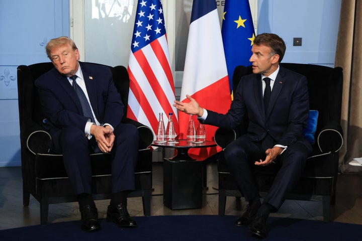 President Donald Trump (left) attends a bilateral meeting with French President Emmanuel Macron on the sidelines of the G7 summit, in Evian, France, on Monday. 