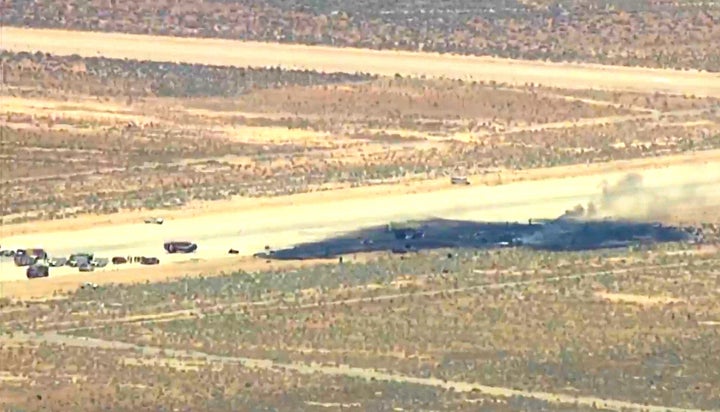 This image, taken from a video provided by KABC, shows law enforcement responding to the scene of an aircraft crash on June 15, 2026, near Edwards Air Force Base, Calif.