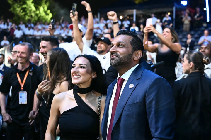 FBI Director Kash Patel stands with his girlfriend, singer Alexis Wilkins, at the conclusion of the UFC fights on the White House lawn.