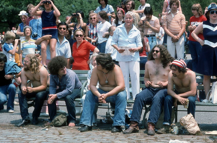 View of people, gathered in downtown Manhattan, during the bicentennial celebrations, New York, New York, July 4, 1976. They were there to watch a display of the tall ships as they sailed into New York Harbor. (Photo by Walter Leporati/Getty Images)