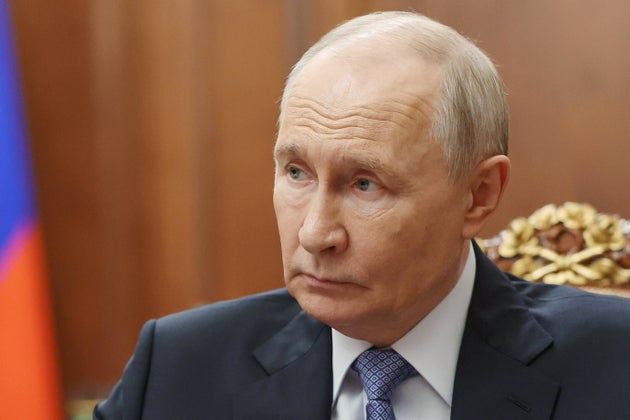 Russian President Vladimir Putin speaks with Sergei Menyailo, the North Ossetia-Alania Republic Head, during their meeting at the Kremlin in Moscow, Tuesday, June 16, 2026.
