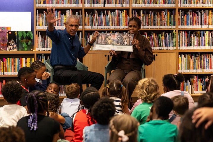 Former President Barack Obama and former first lady Michelle Obama read "Where the Wild Things Are" to students from William H. Ray Elementary School at the Obama Presidential Center's Chicago Public Library branch on Friday.