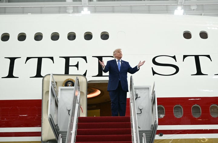President Donald Trump steps out of the new Air Force One, gifted to him by by Qatar, in a hangar at Joint Base Andrews in Maryland on June 19, 2026. (Photo by Brendan SMIALOWSKI / AFP via Getty Images)