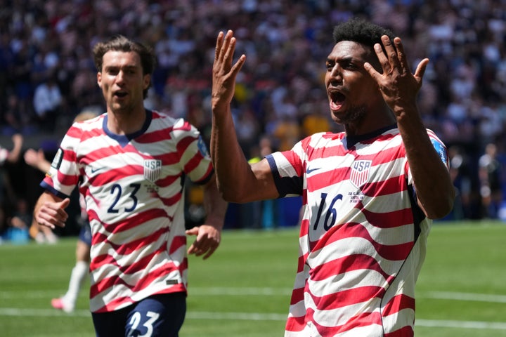 USA players Joe Scally (left)) and Alex Freeman on Friday after beating out Australia 2-0.