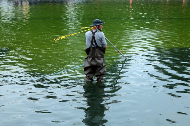 National Park Service employees and contractors use vacuums to remove green algae from the bottom of the Lincoln Memorial Reflecting Pool on June 18, 2026 in Washington, DC. (Photo by Chip Somodevilla/Getty Images)
