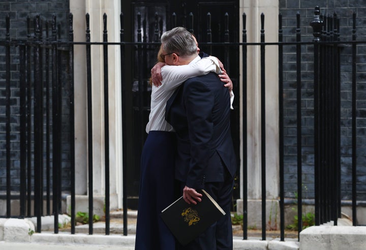 Prime Minister Keir Starmer hugs his wife, Victoria Starmer, after announcing his resignation as U.K. prime minister and Leader of the Labour Party, outside Downing Street on Monday.