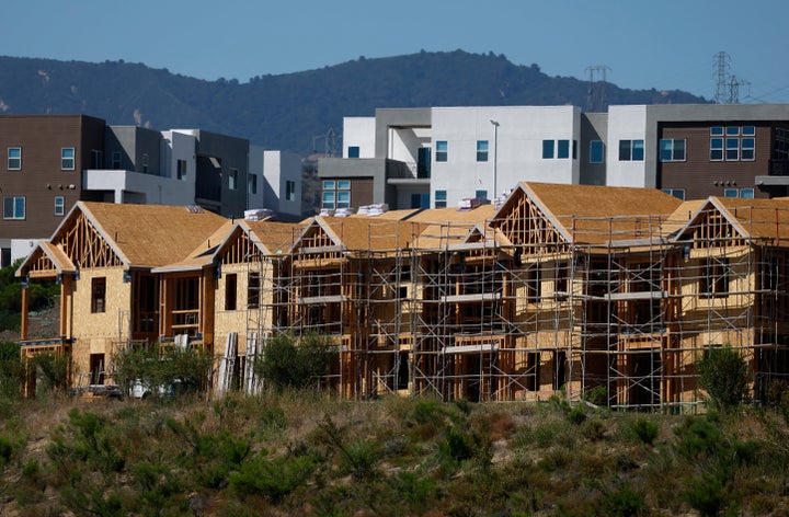 Homes are seen under construction at a new housing development on June 24 in Valencia, California.