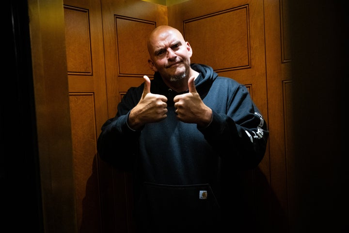 Sen. John Fetterman (D-Pa.) gives thumbs-up while leaving the Senate floor on June 15. The avowed moderate wrung his hands Tuesday over "dirtbag left" candidates' popularity after primary polls closed in New York.