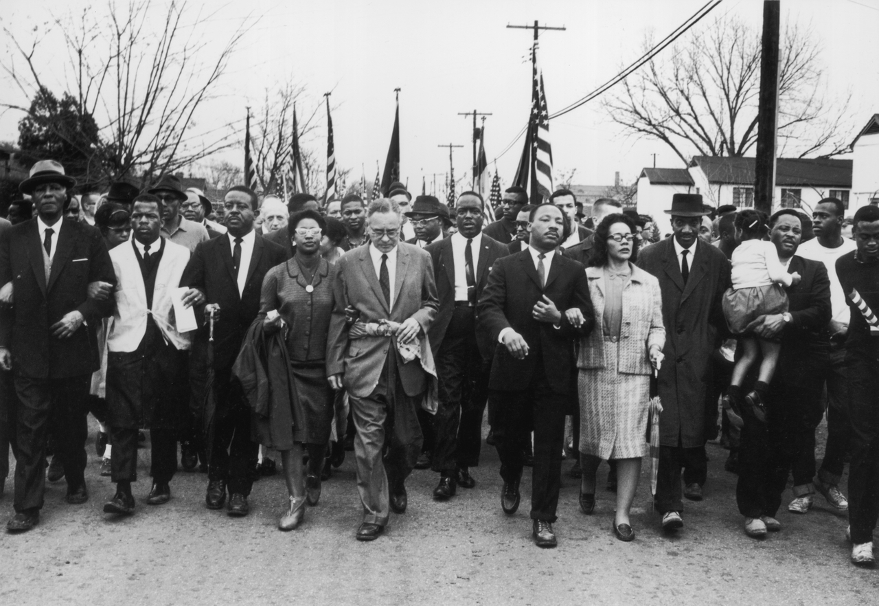American civil rights campaigner Martin Luther King and his wife, Coretta Scott King, lead a black voting rights march from Selma, Alabama, to the state capital in Montgomery in March 1965.