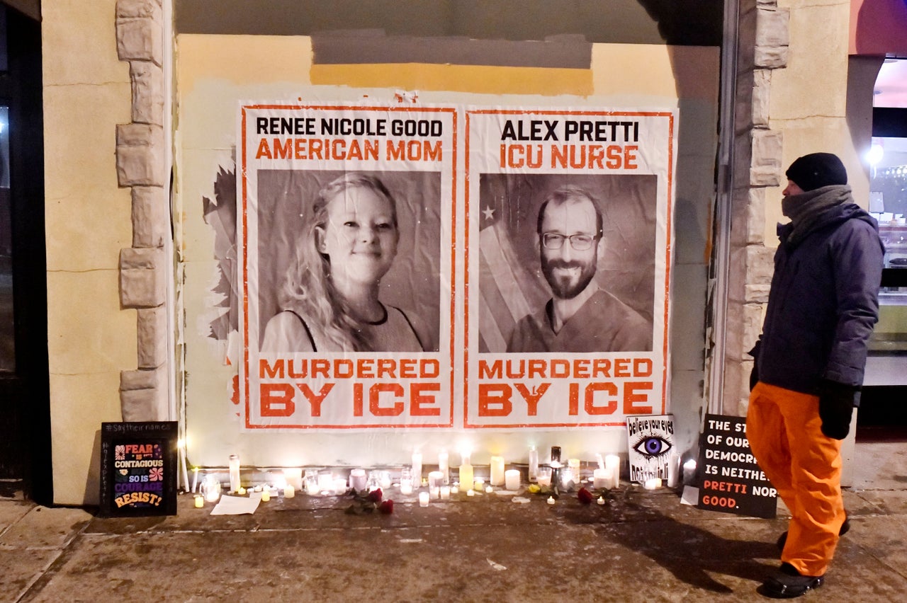 Posters of Renee Nicole Good and Alex Pretti, both U.S. citizens fatally shot by immigration agents earlier this month, are seen during a candlelight vigil in Minneapolis, Minnesota, on Jan. 28, 2026. 
