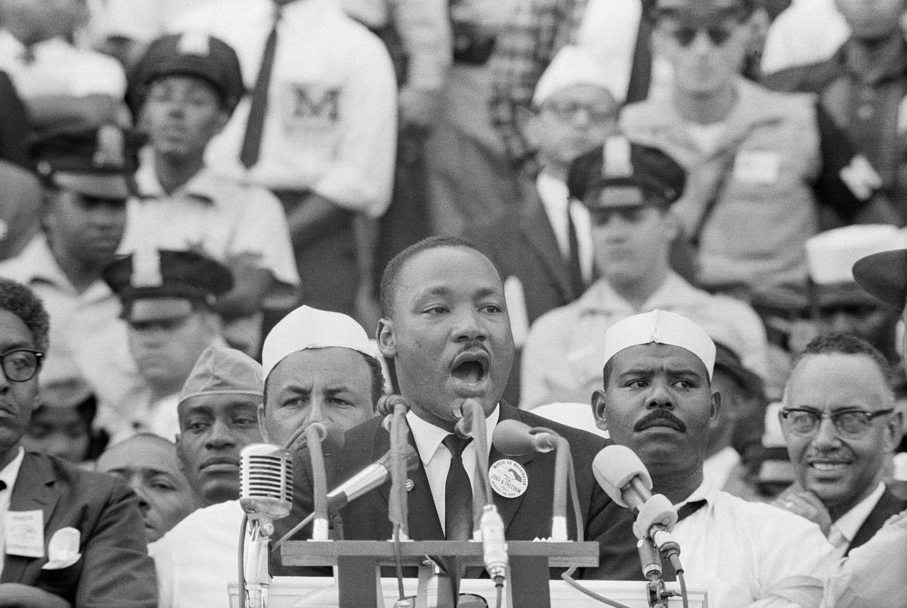 Dr. Martin Luther King Jr. delivers his renowned "I Have a Dream" speech in front of the Lincoln Memorial during the Freedom March on Washington in 1963.