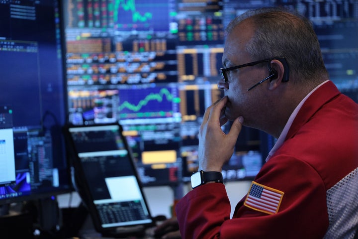 Traders work on the floor of the New York Stock Exchange during morning trading on June 26, 2026 in New York City. (Photo by Michael M. Santiago/Getty Images)