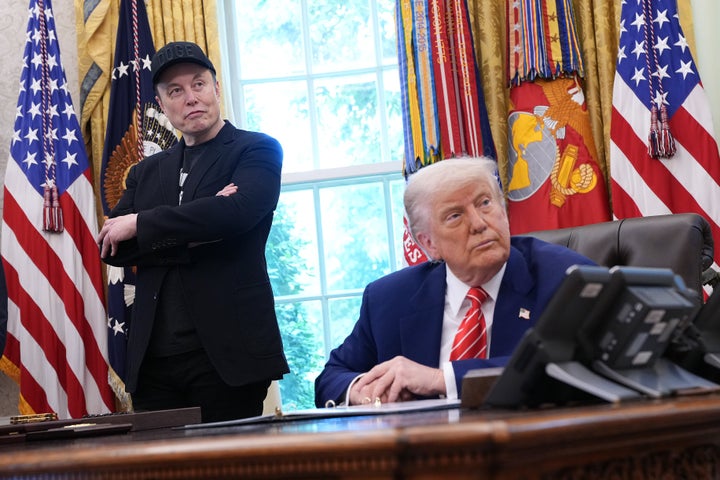 Elon Musk and President Donald Trump listen to a question from reporters in the Oval Office of the White House on May 30, 2025, in Washington, D.C.
