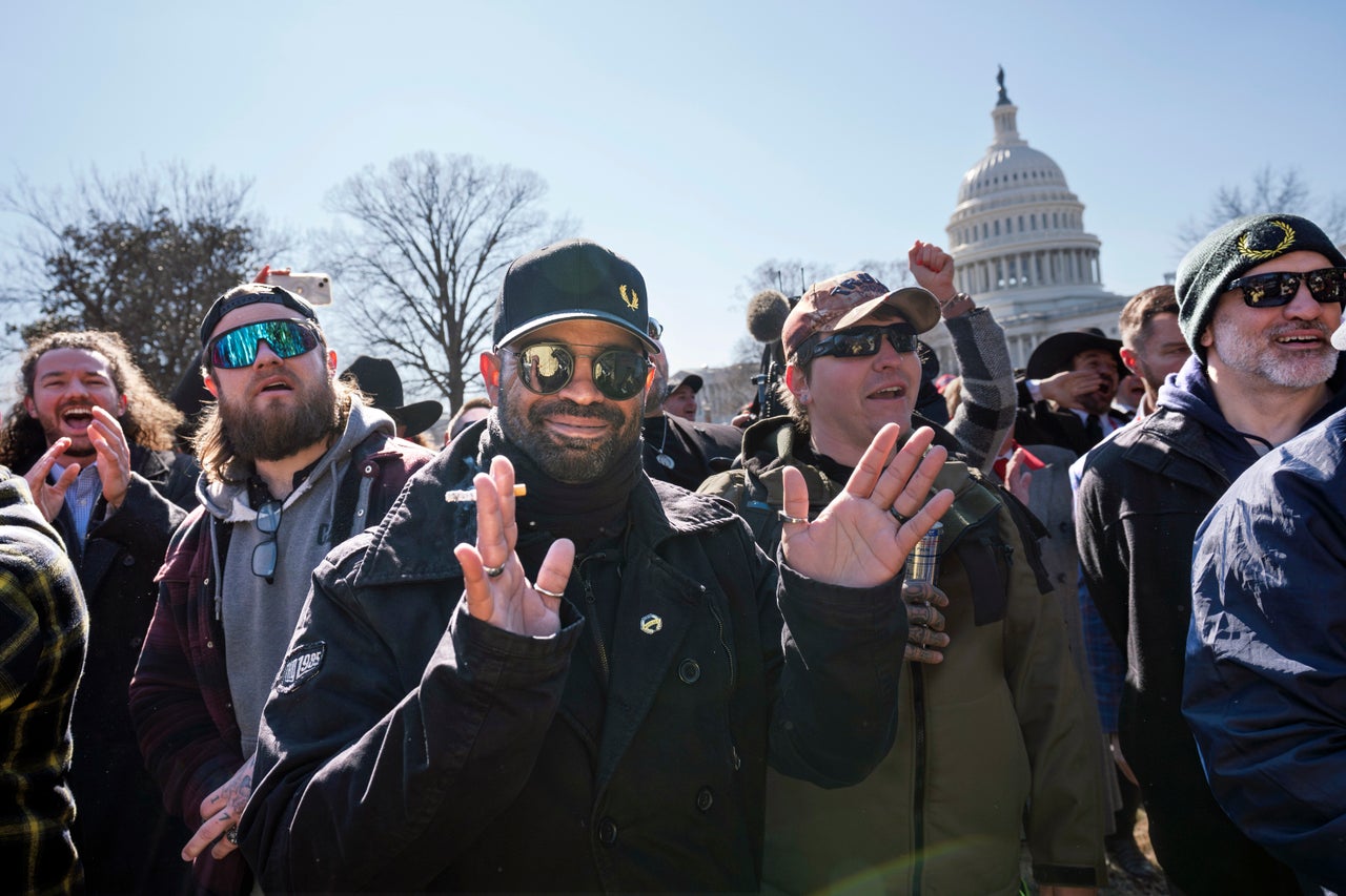 Former Proud Boys leader Enrique Tarrio (center) attends a news conference at the U.S. Capitol in Washington on Feb. 21, 2025.