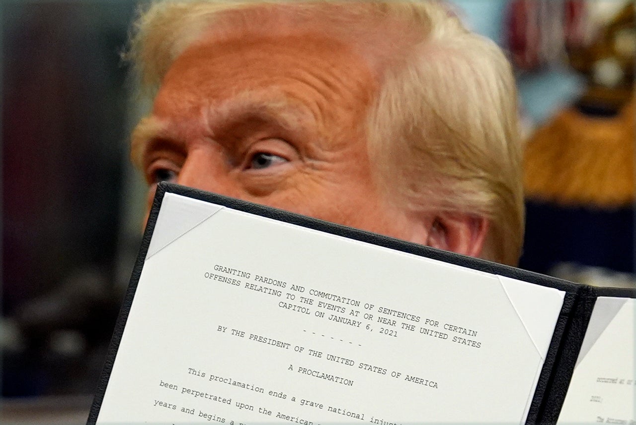 On Jan. 20, 2025, his first day back in office, President Donald Trump signs an executive order pardoning about 1,500 defendants charged in the Jan. 6 attack on the U.S. Capitol.