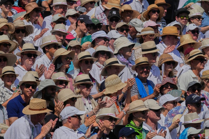 Spectators wear hats against the heat during the final of the Bad Homburg Open WTA tennis tournament in Bad Homburg, Germany, Saturday, June 27, 2026. (AP Photo/Michael Probst)