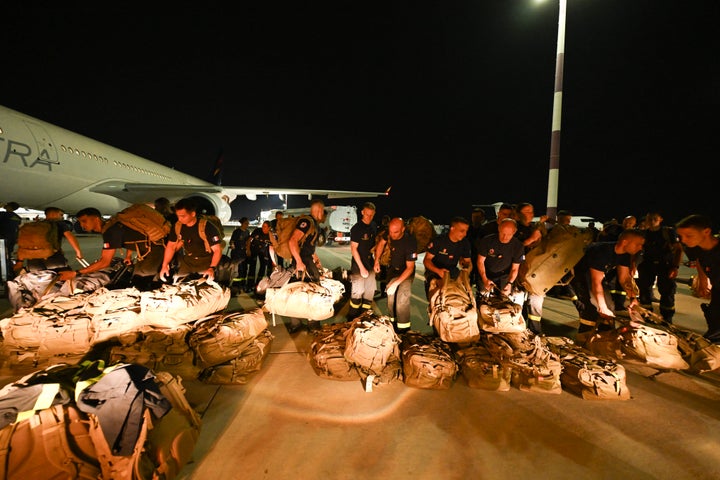 French officers of the 7e Régiment d'Instruction et d'Intervention de la Sécurité Civile (7e RIISC - The 7th Civil Security Training and Response Regiment) prepare their shipment before flying to Venezuela to provide help after two earthquakes hit the country, at the Marseille Provence Airport in Marignane, southern France, on June 27, 2026. (Photo by Miguel MEDINA / POOL / AFP via Getty Images)