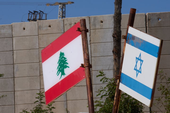 Israeli and Lebanese flags hang in a memorial site on the border with Lebanon in northern Israel, Saturday, June 27, 2026 after Israel and Lebanon sign a framework agreement. (AP Photo/Ariel Schalit)