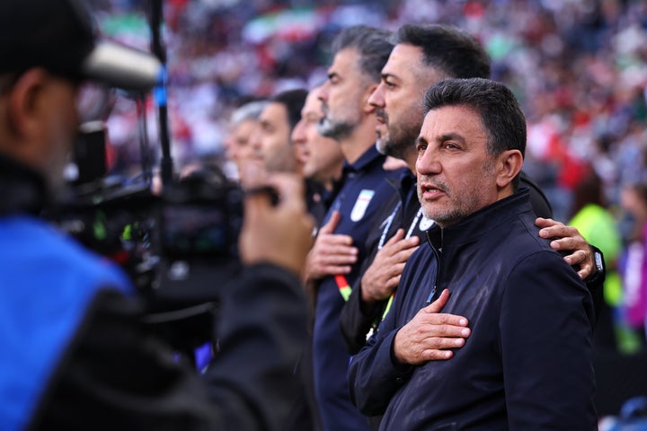 Amir Ghalehnoy Manager / Head Coach of Iran sings the national anthem during the FIFA World Cup 2026 Group G match between Egypt and IR Iran at Seattle Stadium on June 26, 2026 in Seattle, United States. (Photo by Robbie Jay Barratt - AMA/Getty Images)