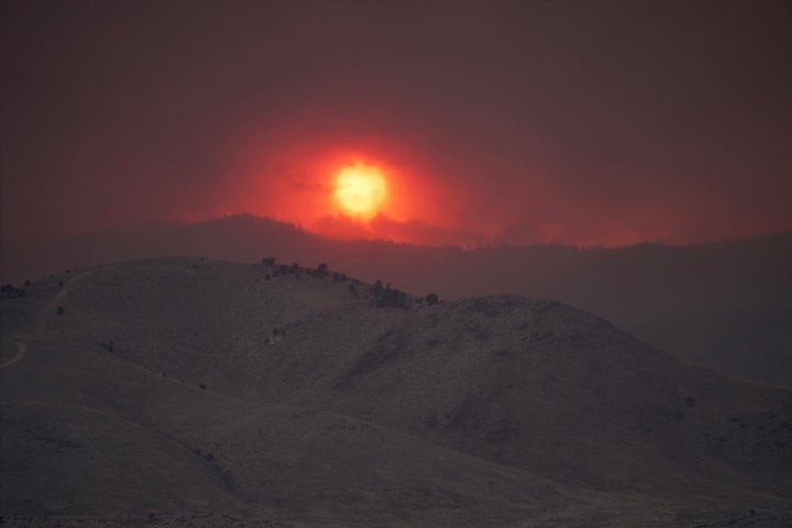 The sun sets over the Cottonwood Fire near Marysvale, Utah, on Friday. 