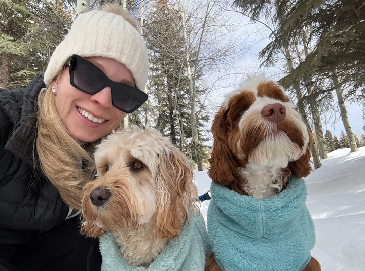 The author walking with her beloved dogs, Honey and Rocky, in February 2026.