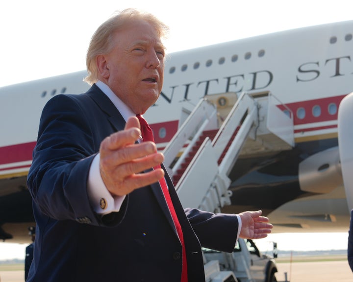 President Donald Trump speaks to reporters before boarding Air Force One, Wednesday, July 1, 2026, at Joint Base Andrews, Md. (AP Photo/Julia Demaree Nikhinson)
