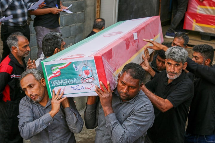 FILE.- A coffin is carried during the funeral of mostly children killed in a strike Feb. 28 at a primary school in Minab, Iran, Tuesday, March 3, 2026. (Abbas Zakeri/Mehr News Agency via AP, File)