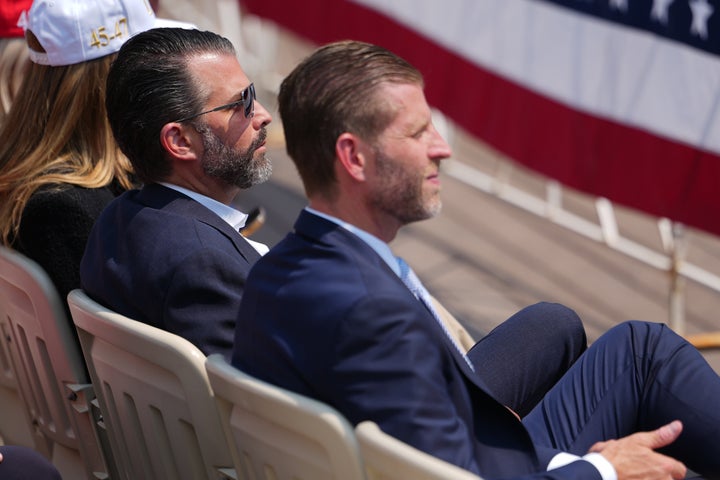 Donald Trump Jr. and Eric Trump listen as President Donald Trump speaks at the Theodore Roosevelt Presidential Library on Wednesday in Medora, North Dakota.
