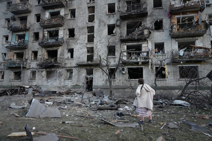 A woman stands at the site of a Russian missile strike that hit a residential building in Kyiv, Ukraine, on July 2, 2026.
