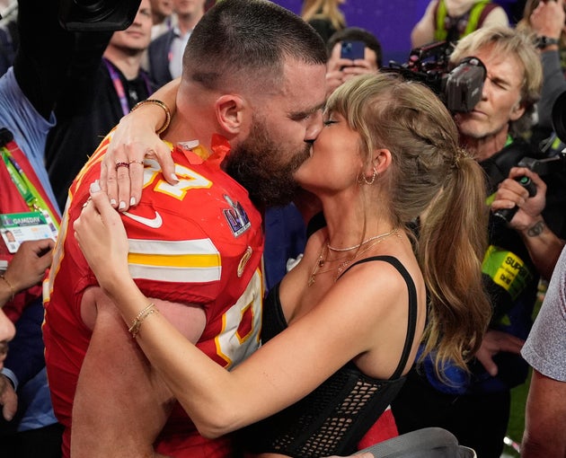 Travis Kelce and Taylor Swift share a kiss at the 2024 Super Bowl