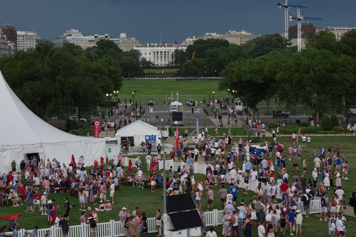 The White House is seen in the distance as people evacuate the area after people were told of incoming storms that will delay the program at a Salute to America Independence Day event honoring the nation's 250th anniversary, Saturday, July 4, 2026, on the National Mall in Washington. (AP Photo/Julia Demaree Nikhinson)
