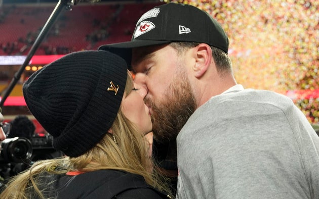 Taylor Swift and Travis Kelce share a kiss in January 2025