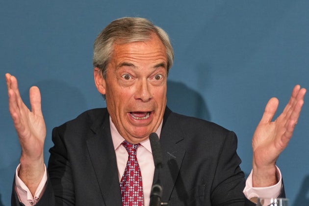 Nigel Farage, leader of the Reform UK party, gestures as he speaks at a press conference in London, Monday, April 13, 2026. (AP Photo/Kirsty Wigglesworth)