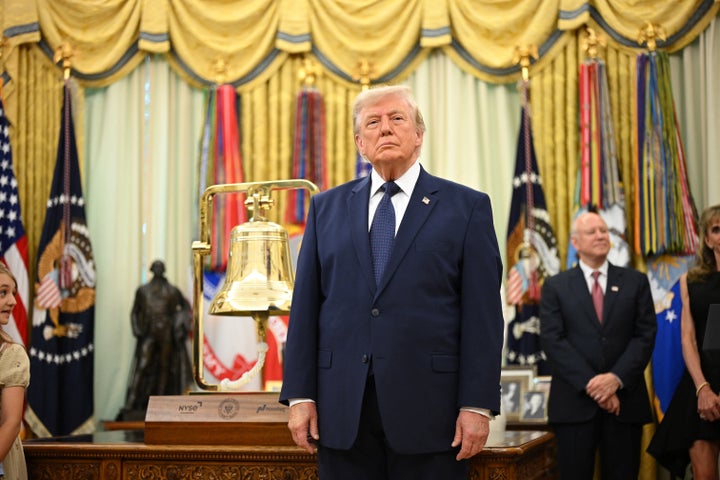 Trump stands next to a bell before ringing it to open the New York Stock Exchange ahead of the launch of Trump investment accounts on July 6, 2026.