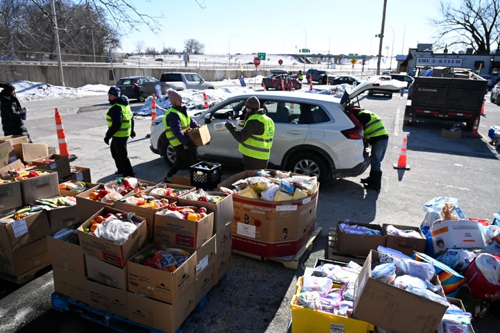 People prepare food packages for immigrants at the Dios Habla Hoy church, which has become a nerve center for locals opposing immigration raids, in Minneapolis, Minnesota, on January 2026.