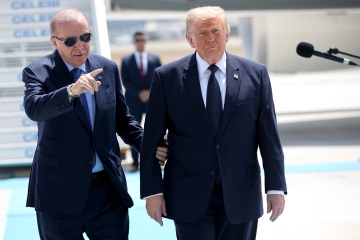 Turkish President Recep Tayyip Erdogan guides U.S. President Donald Trump as he arrives for the annual NATO summit on July 7, 2026, in Ankara, Turkey.