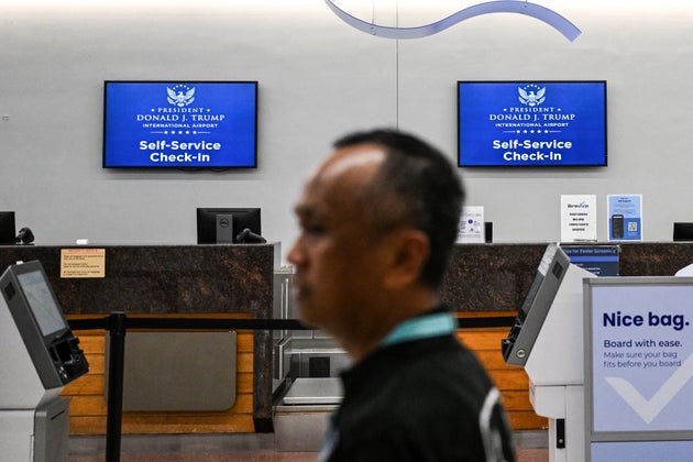 A traveler walks past new welcome s...                    </div>

                    <div class=